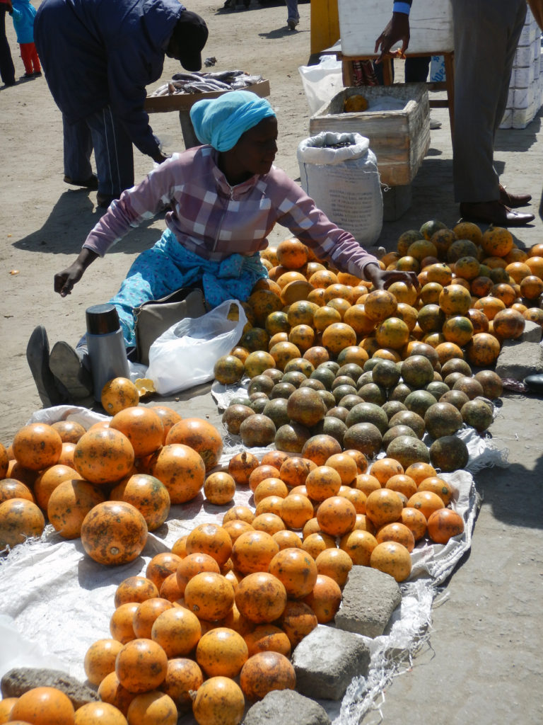 One of many open-air grocery stands. Women are learning skills to run small businesses to help support their families.