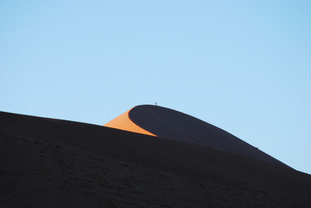 A lone hiker atop Dune 45